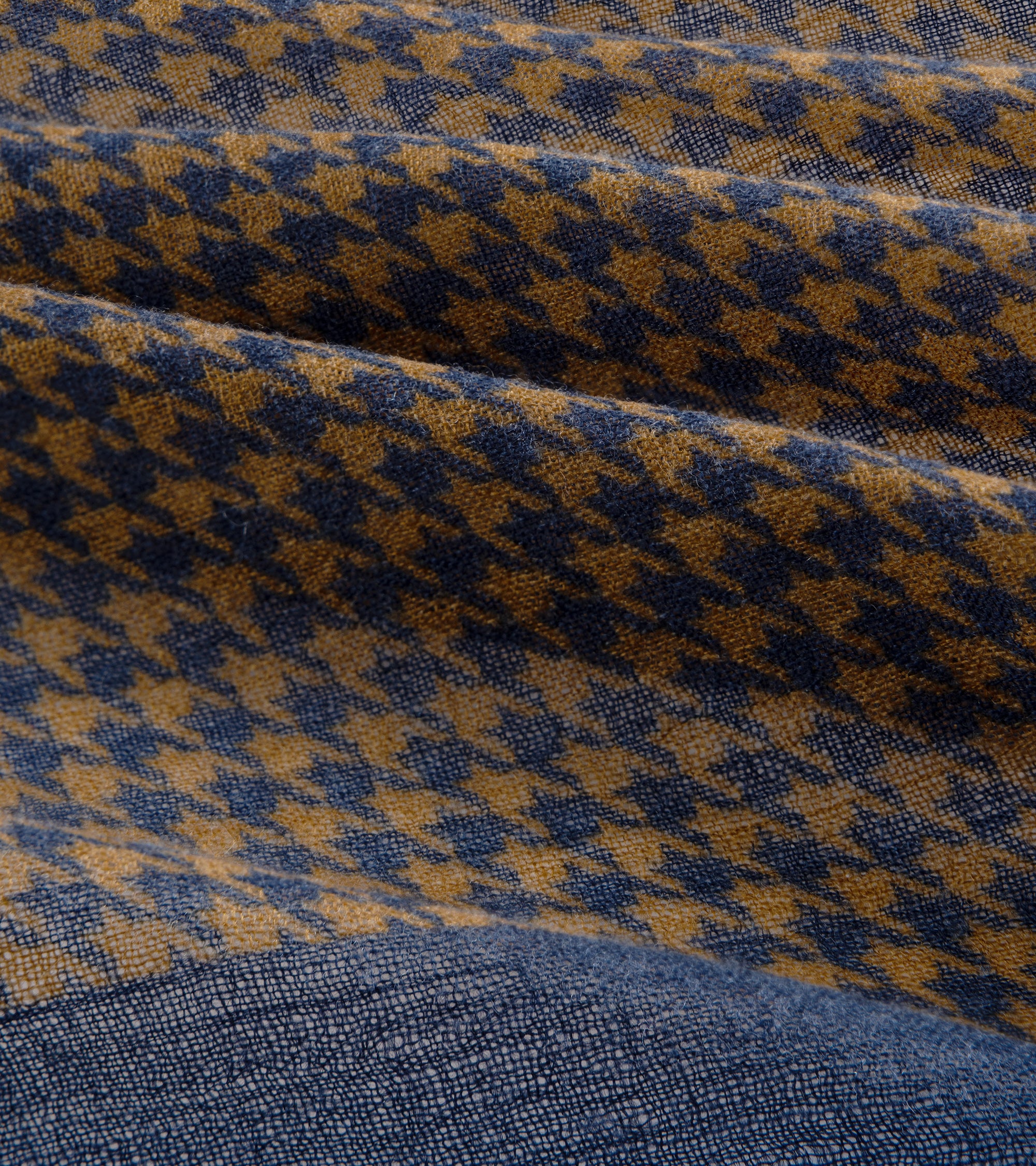 Close-up detail of the bandana houndstooth pattern in blue and yellow.