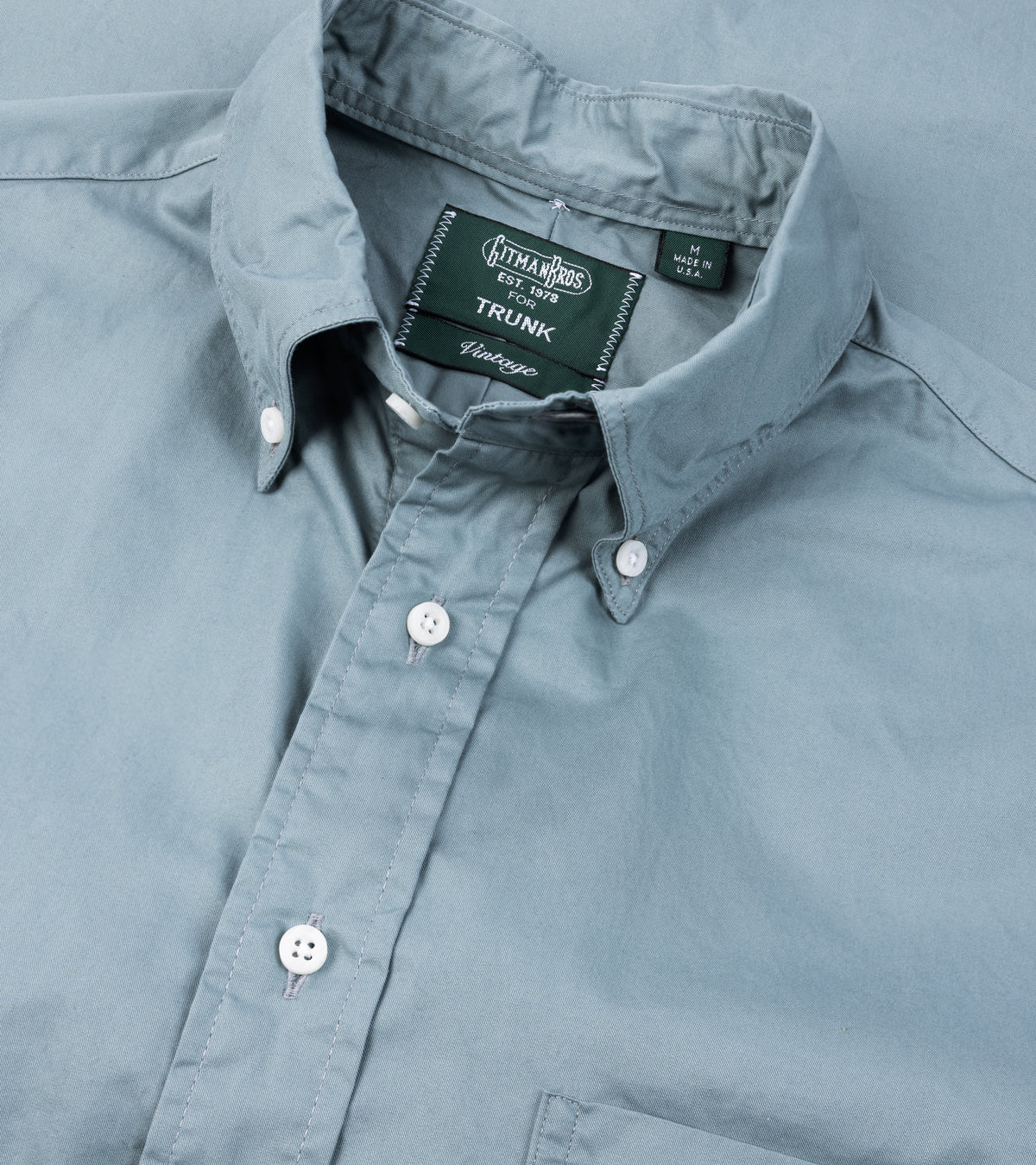 A close-up of the Gitman Vintage Japanese Cotton Twill Button Down Shirt in Slate Blue showing the collar and mother of pearl buttons.