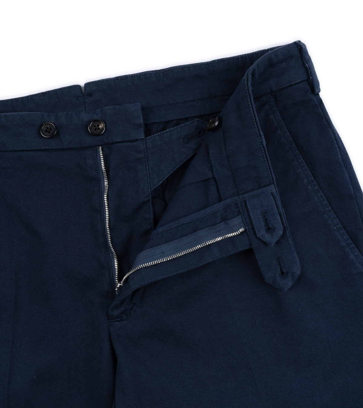 Close-up of the Trunk Palmer Flat Front Cotton Twill Trousers in Navy showing the waistband, belt loops, front zipper.