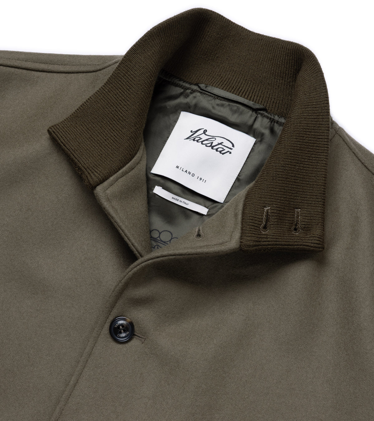 Valstar Valstarino Wool Felt Jacket in Olive. Close-up detail of the collar spread with the top button undone. Valstar label shown and Valstar branding on the button.