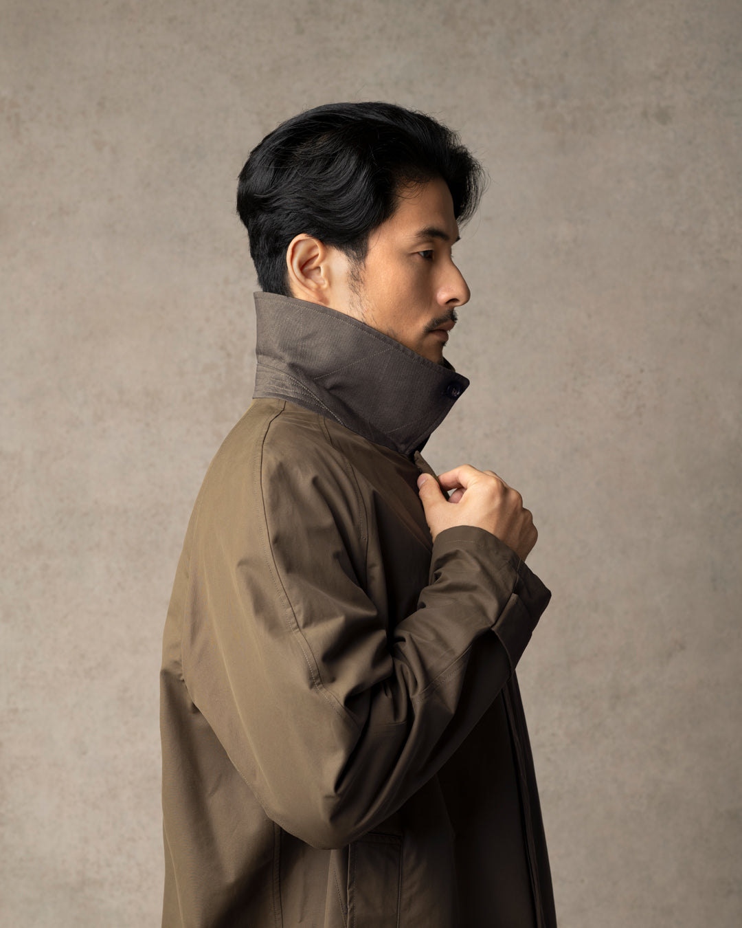 Man wearing Trunk Clothiers raincoat