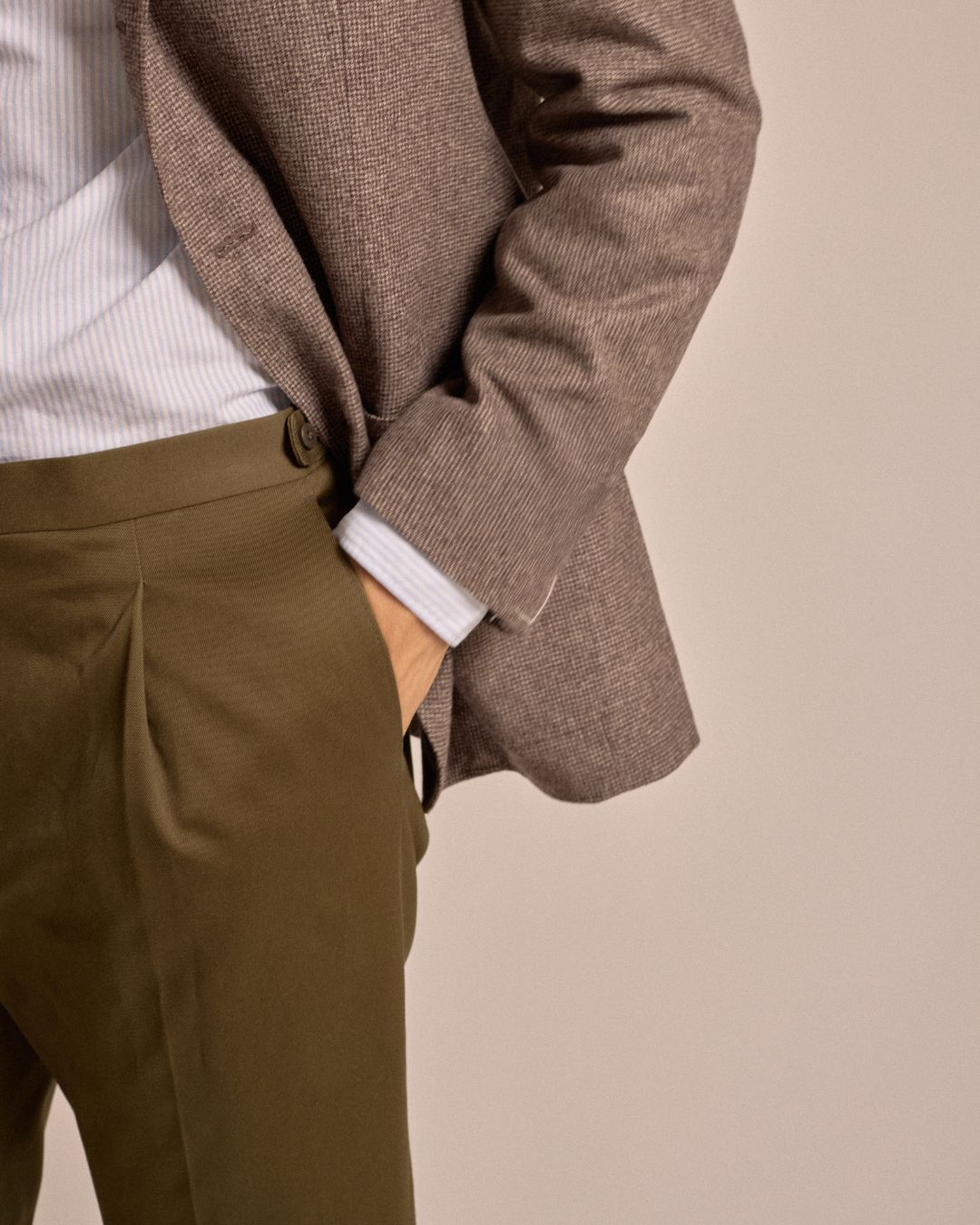 Echizenya for Trunk heavy chino trousers in olive. A styled shot with a close-up up the model's hand in the pocket.