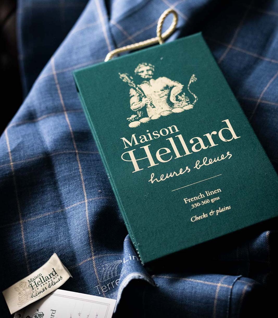 Maison Hellard label on a blue plaid fabric background