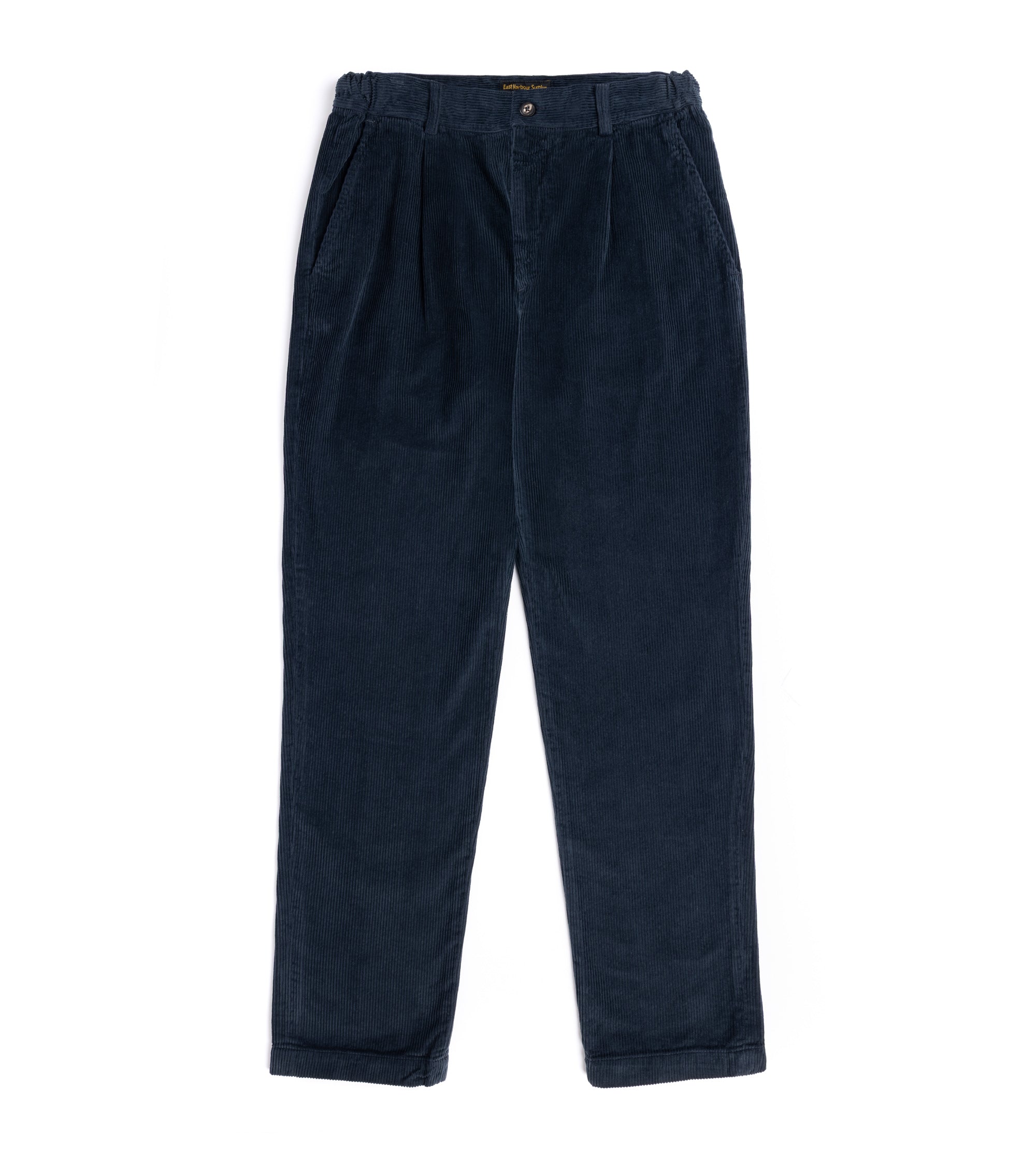 A pair of dark navy blue corduroy trousers with a pleated front and button waist and side pockets.