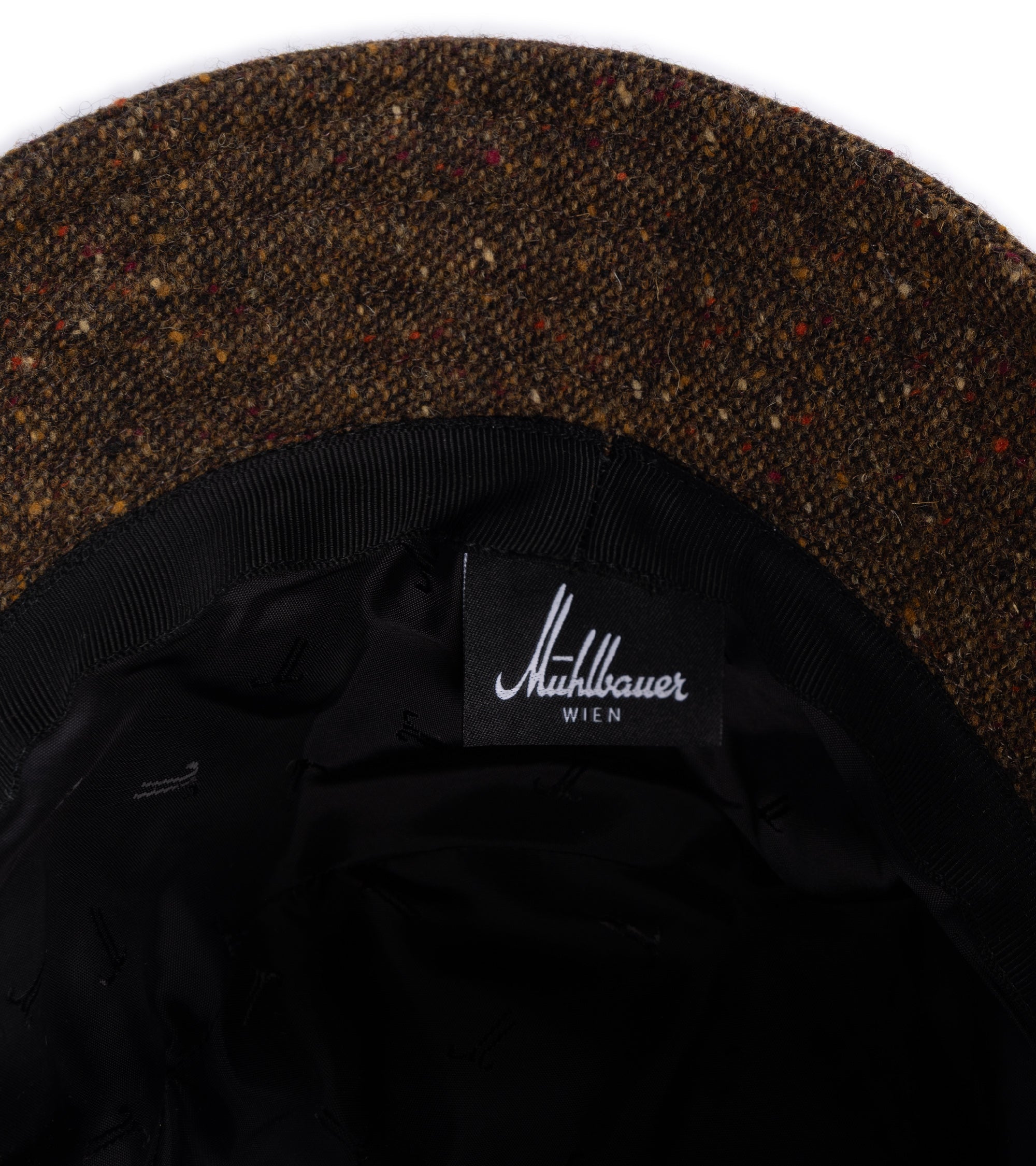 Close-up of the interior of a hat showing the lining.