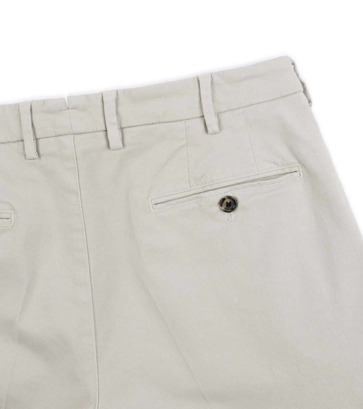 Back close-up of the Trunk Palmer Flat Front Cotton Twill Trousers in Greige showing the waistband, belt loops, a rear welt pocket with a button.