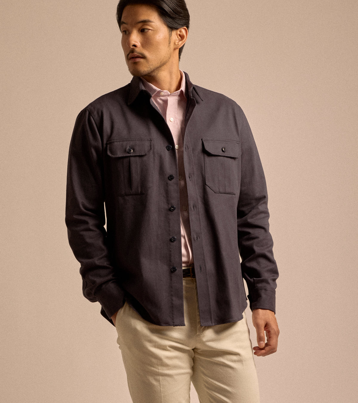 Model wearing Salvatore Piccolo Cotton Twill Military Shirt in navy, styled with Salvatore Piccolo red and white stripe, Anderson's braided leather belt and Palmer trouser in sand.